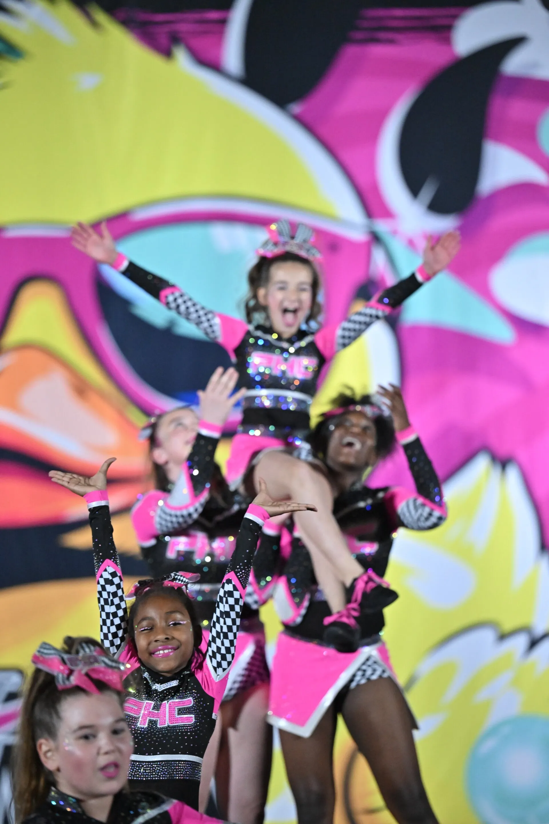 Powerhouse Cheer athletes celebrating after a routine